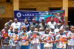 L-R: Head of Operations and Innovation, Lagos State Signage and Advertisement Agency (LASAA), Mr Adegbolahan Dixon; Head Teacher, Anglican Primary School, Igbogbo, Ikorodu, Ms Akeredolu Kehinde; Hon. Gbolahan Ogunleye representing Ikorodu 1 House of Assembly (Chairman SDG and Overseas Investment); MD/CEO, LASAA, Prince Fatiu Akiolu; Chairman Omo Daada Foundation, Hon. Omoniyi Dada; and Head, Corporate Communications and Strategy, LASAA, Mrs. Atinuke da-Silva-Osadjere at the presentation of bags and writing materials in Anglican Primary School, Igbogbo, Ikorodu, Lagos recently.