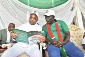 Governor Hope Uzodimma of Imo State ( left), with the Chairman of the Nigeria Labour Congress, Imo State Chapter, Comrade Chigaemezu Nwigwe during the Workers Day celebration at Rear Admiral Ndubuisi Kanu Square, Owerri... Thursday.