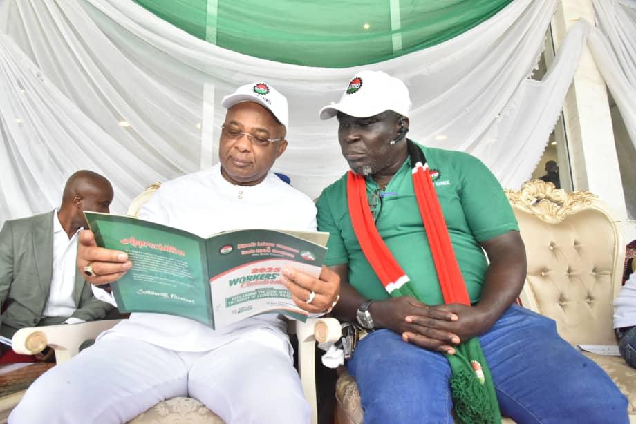 Governor Hope Uzodimma of Imo State ( left), with the Chairman of the Nigeria Labour Congress, Imo State Chapter, Comrade Chigaemezu Nwigwe during the Workers Day celebration at Rear Admiral Ndubuisi Kanu Square, Owerri... Thursday.