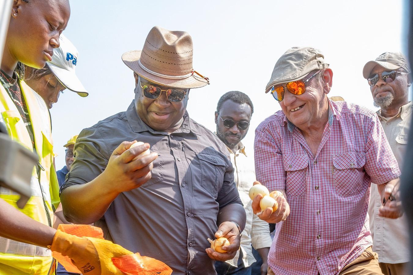 President Bio observing locally produced onions to achieve food sufficiency
