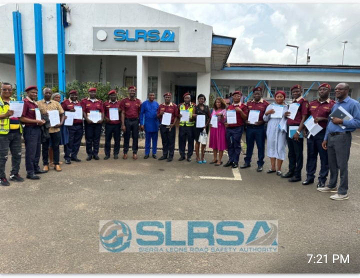 Group photo of all Heads of Directorates displaying signed contracts