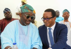 National Head of Sales, First City Monument Bank (FCMB), Mr. Emmanuel Comla (right) and Chairman, Eti-Osa East Local Council Development Area, Hon. John Ogundare (left), at the commissioning ceremony of the Bank’s new branch at Sangotedo, Lekki-Epe Expressway, in Lagos on June 26, 2025