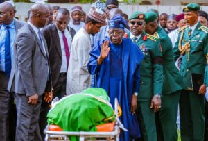 Tinubu at Buhari's grave side