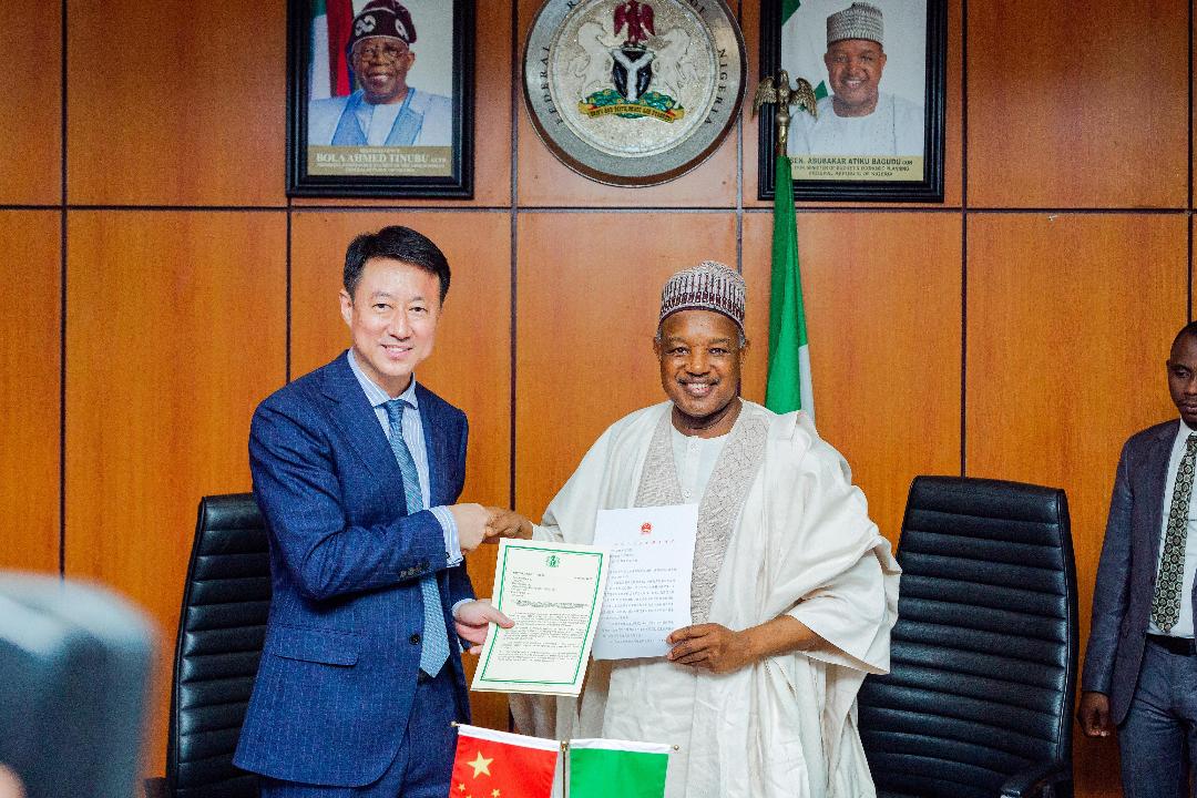Chinese Ambassador to Nigeria, Mr Yu Dunhai (left), and Minister of Budget and Economic Planning, Senator Abubakar Bagudu, during the signing of an Exchange of Notes on the Chinese government's $1 million relief support for flood victims in the North in Abuja on Wednesday, 27/08/25. PHOTO: FMBEP