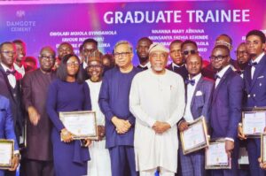 Some of the newly inducted Graduate trainees of the Dangote Cement, posing with some Board members and the Programme Coordinator, Mr. Iyal H. Abdulkareem, at the induction ceremony and Long Service Awards / Hall of Fame Employee Awards held in Lagos over the weekend