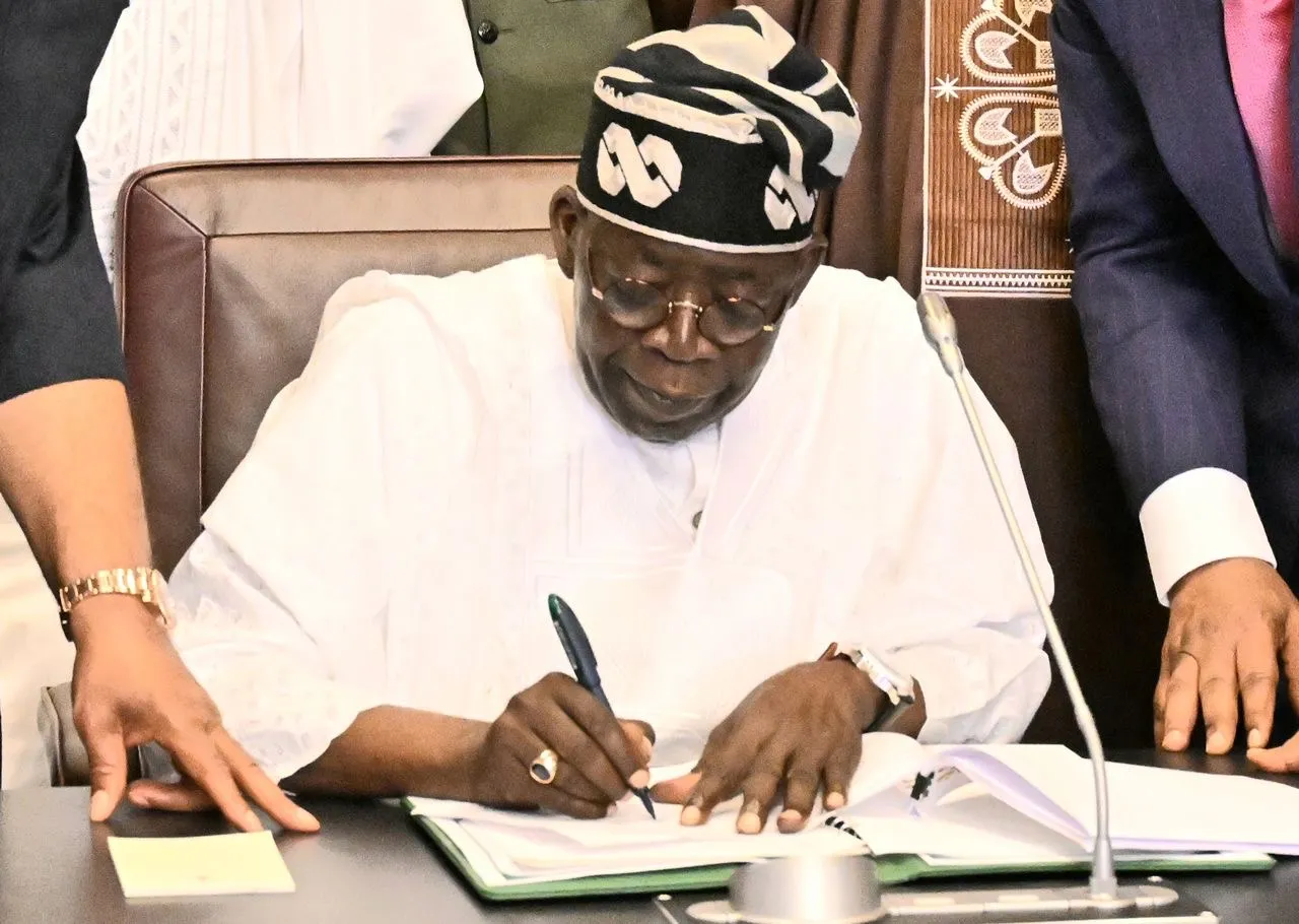 President Bola Tinubu signing