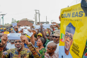 The Ogun State Governor; Prince Dapo Abiodun displaying his All Progressives Congress(APC) membership card during the primary election to choose the Ogun East Senatorial District candidate for the 2027 general elections at Ward 3, Iperu,Iperu-Remo,Ogun State on Monday